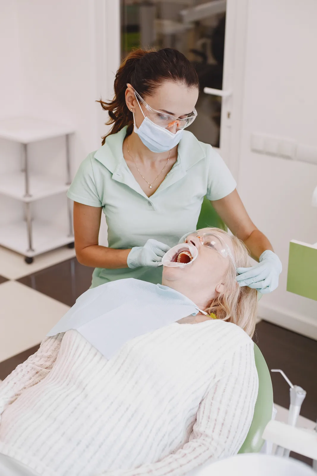 Cheek retractor placed before treatment, alongside the Full Mouth Cost explanation in Victoria