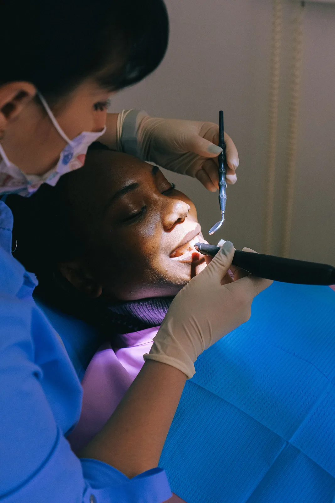 Curing light used during a restoration, referred to in the Full Mouth Implants section for Victoria