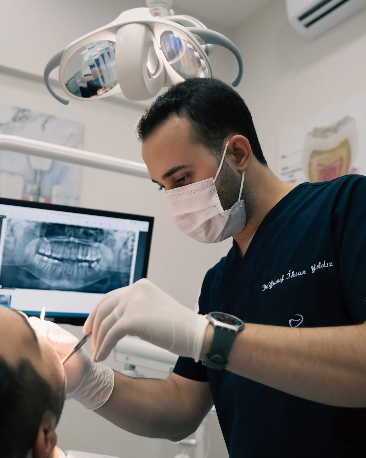 Implant planning from a panoramic X-ray, alongside the Implants Vs Bridge explanation in Victoria