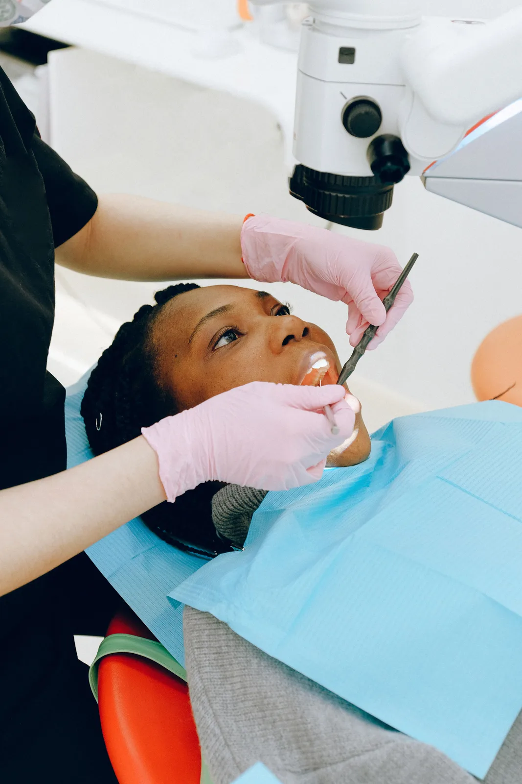 Microscope assisted dental treatment, shown while covering Front Tooth Implant in Victoria