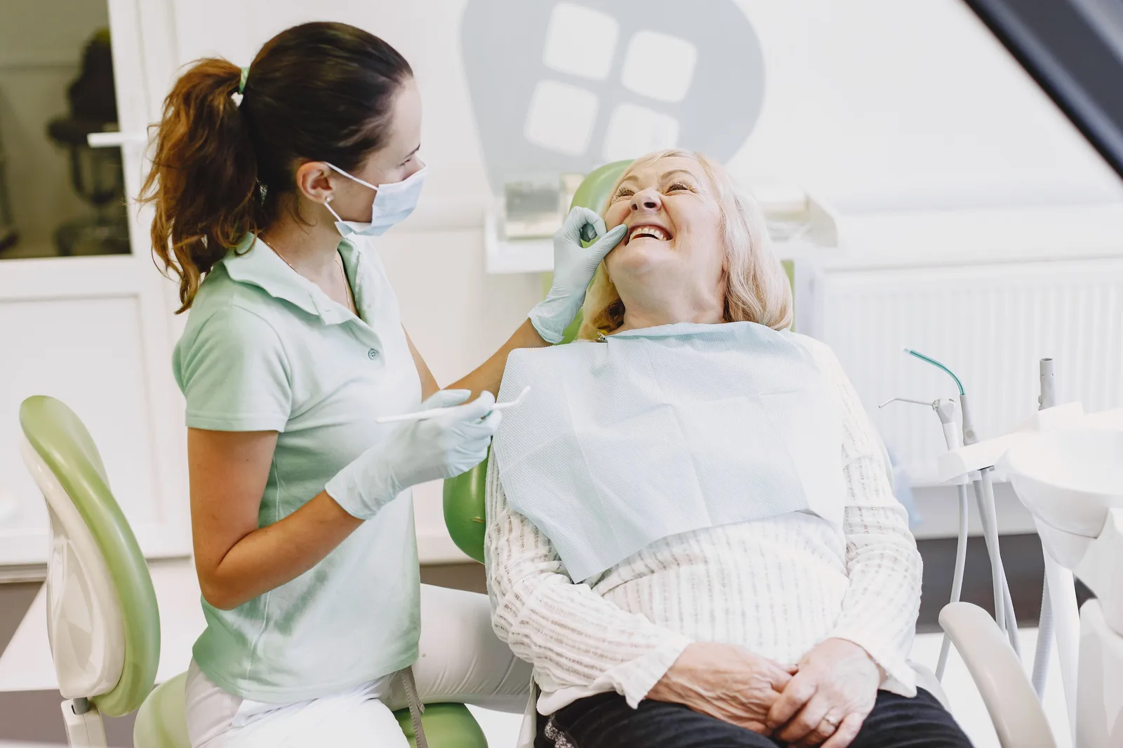 Patient at ease during a dental checkup, shown while covering Single Implant Cost in Victoria