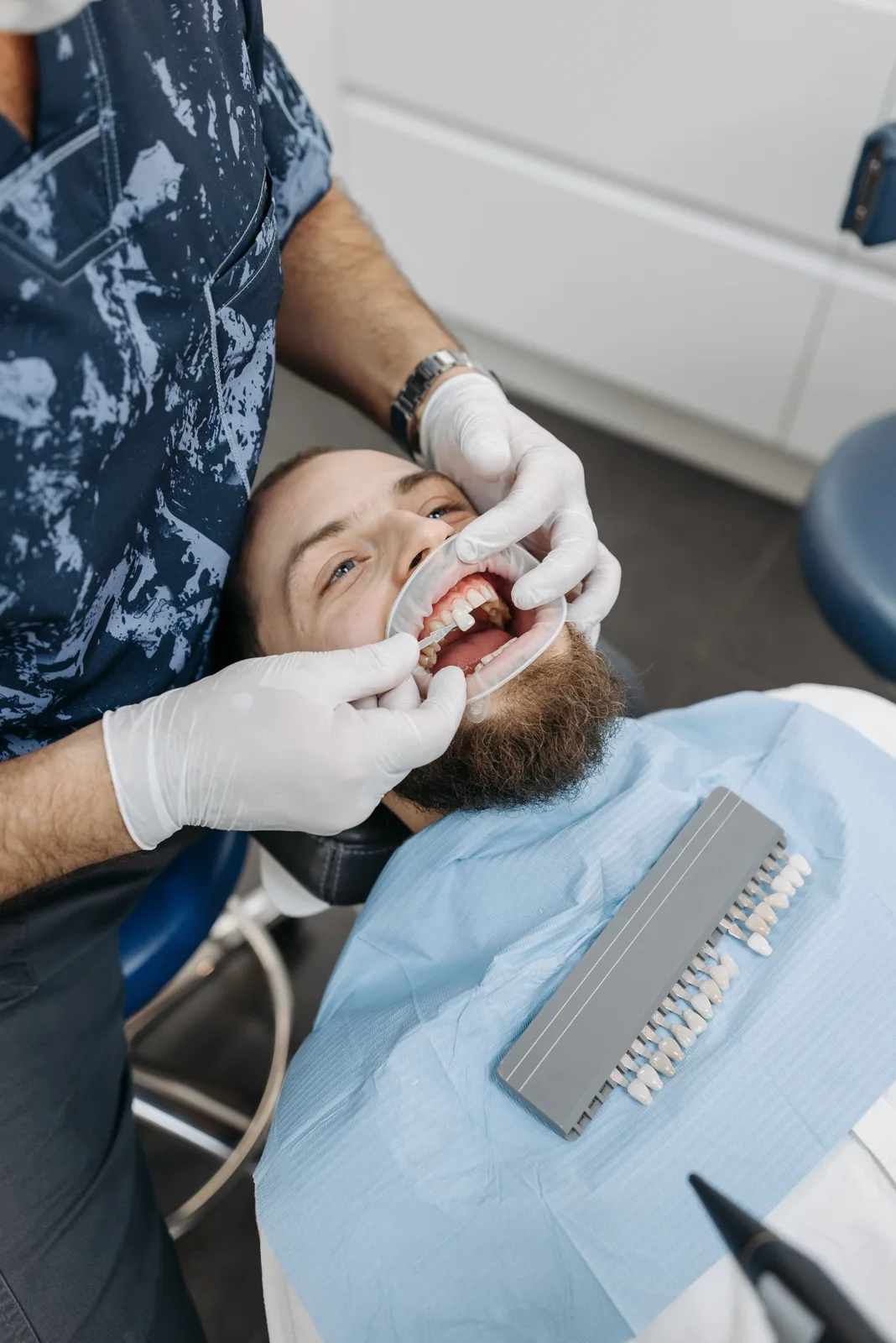 Selecting a crown shade chairside, alongside the Implant Surgery Day explanation in Victoria