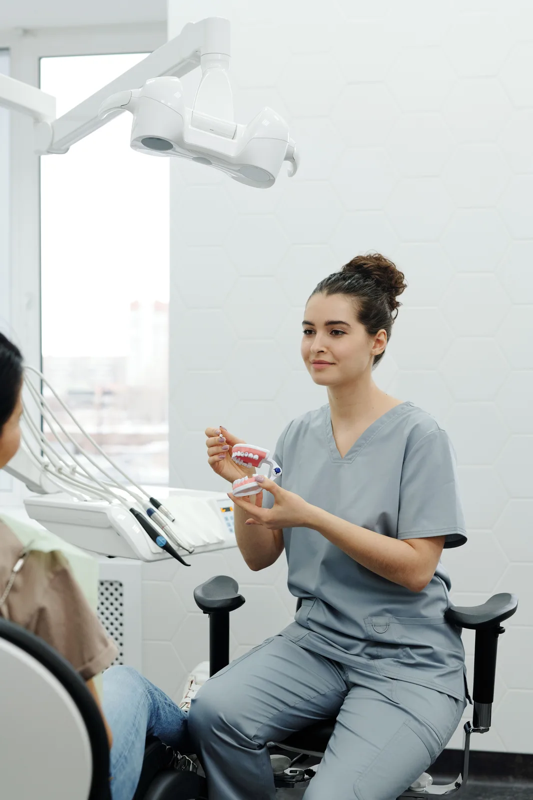 Treatment explained chairside in the operatory, shown while covering Bone Grafting in Victoria