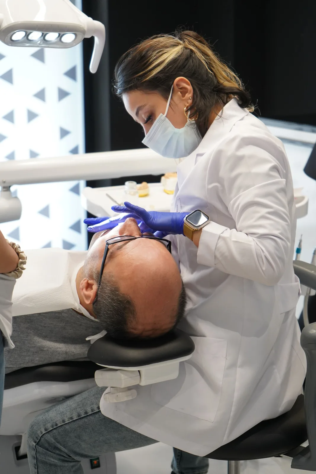 Treatment in a modern operatory, shown while covering Full Mouth Implants in Victoria